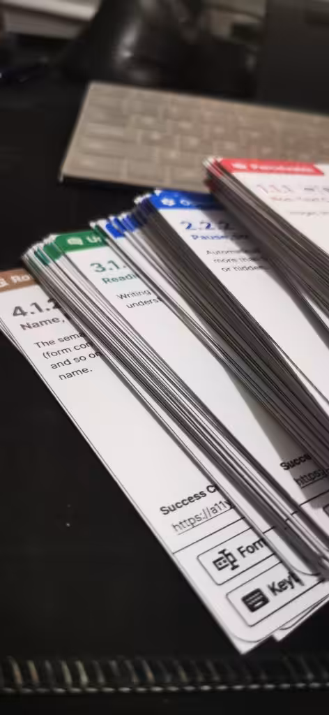 A stack of the WCAG flash cards separated by principles, each with its own color